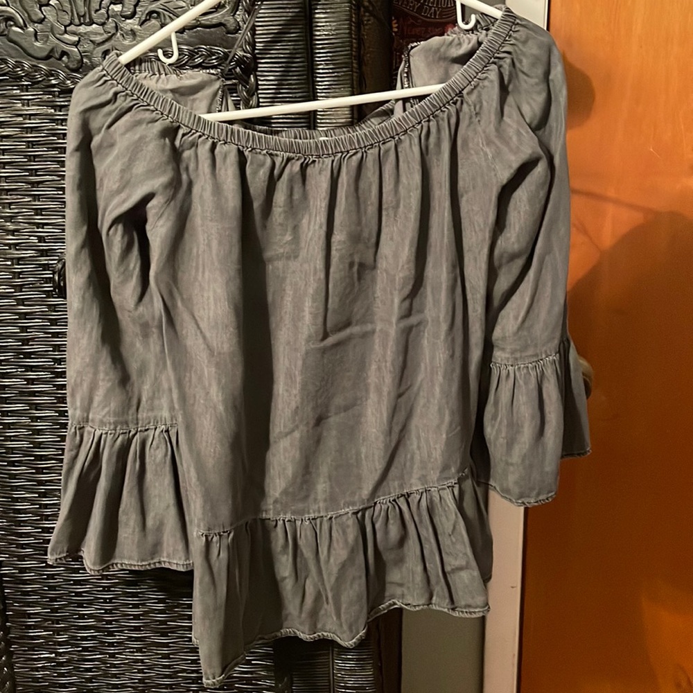 Off the shoulder, ruffled shirt.